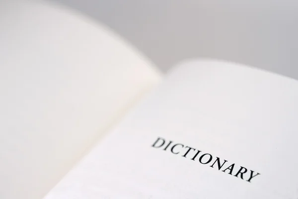 Otwartą książkę w słowniku słowo czytanie na prawej stronie — Zdjęcie stockowe