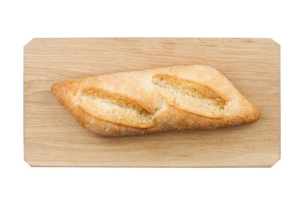 Bílé malé chleba na dřevěné desce — Stock fotografie