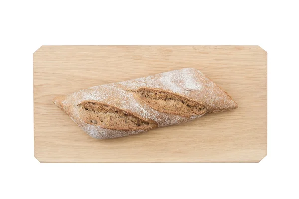 Svart liten bröd på träskiva — Stockfoto