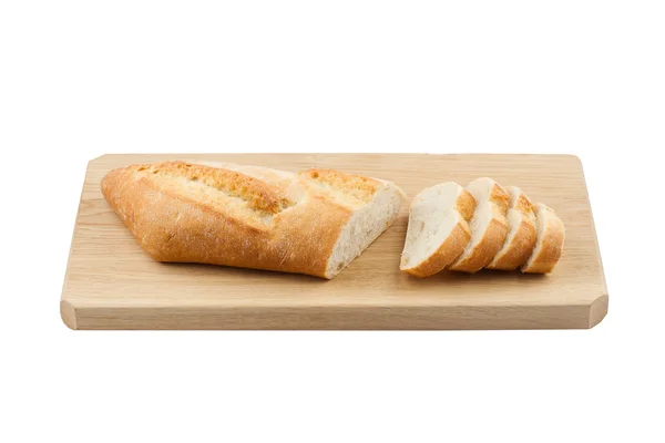 White small bread being cut on wooden board — Stock Photo, Image