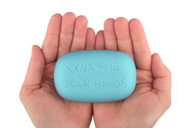 Hands holding blue soap bar with wash your hands written clipart
