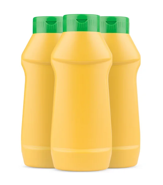 Drie gele mosterd plastic flessen met geen label en groene dop — Stockfoto
