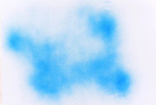 白い紙の背景に青いスプレー塗料 — ストック写真