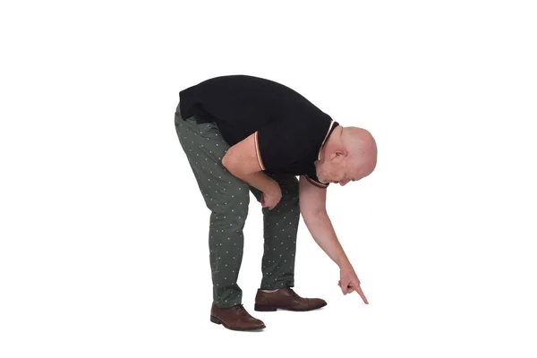 Man Crouching Pointing Floor White Background — Stock Photo, Image