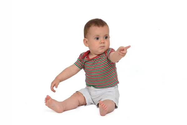 Bebé Meses Sentado Suelo Apuntando Sobre Fondo Blanco — Foto de Stock