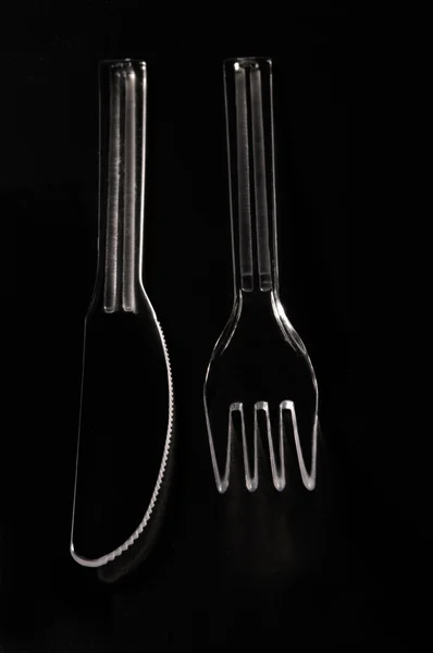Metakrylátu vidlička a nůž s černým pozadím — Stock fotografie