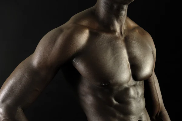 Un hombre negro con un cuerpo musculoso , — Foto de Stock