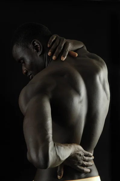 Homem com a mão nas costas — Fotografia de Stock