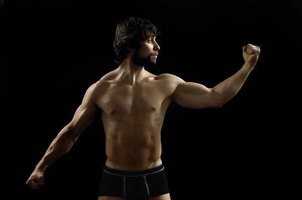 Retrato de un hombre con bíceps — Foto de Stock