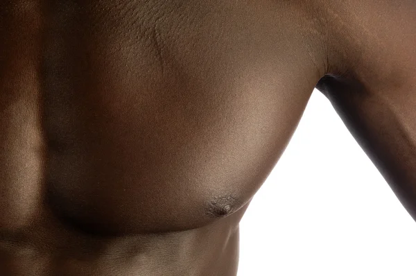 Músculo peitoral de um homem negro com um corpo muscular, backg branco — Fotografia de Stock
