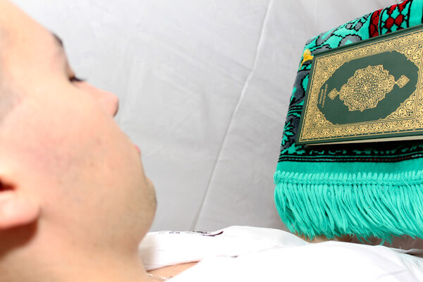 Muslim man Reading Holy Islamic Book Koran