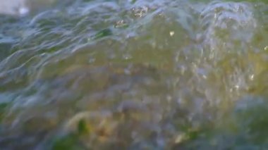 deniz dalgaları, kum dokusu ve kaya detayları