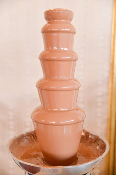 chocolate tower on the table for wedding reception