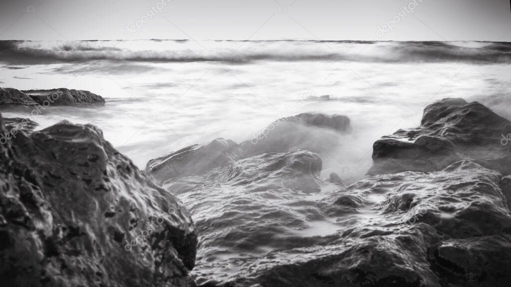 monochrome ocean landscape. black and white sea long exposure shot