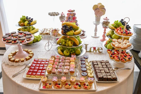 delicious sweets arranged on the table for wedding reception