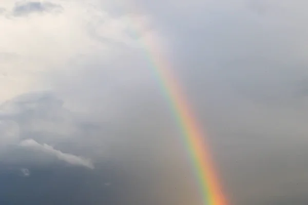 multicolored sun beam on a gray cloudy day