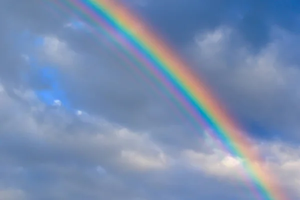 multicolored sun beam on a dark cloudy day