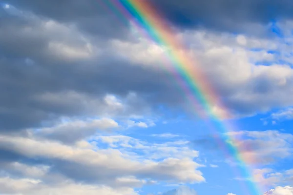 multicolored sun beam on a dark cloudy day