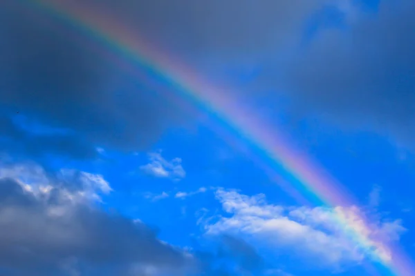 multicolored sun beam on a dark cloudy day