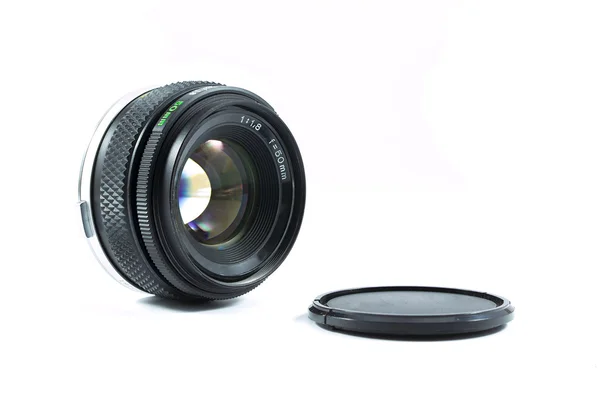 An old manual control camera lens isolated on white. — Stock Photo, Image