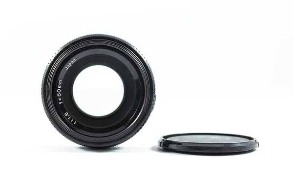 An old manual control camera lens isolated on white. — Stock Photo, Image