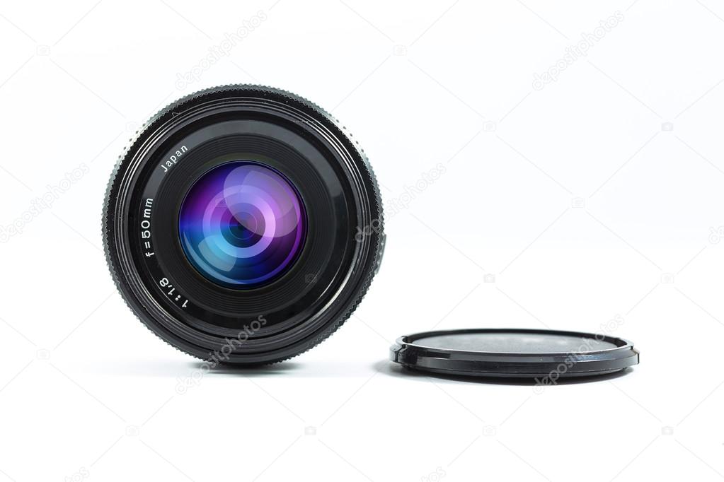 An old manual control camera lens isolated on white.