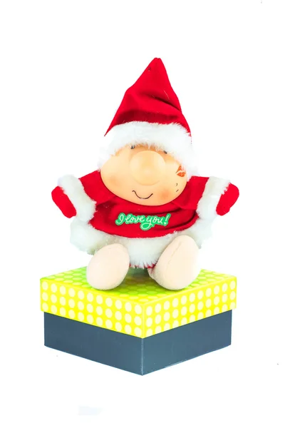 圣诞老人娃娃与分离在白色背景上一个大的礼品盒 — 图库照片