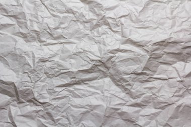 Beyaz buruşmuş kağıt doku arka planı. Beyaz kumaş dokusu kumaşı katlar.