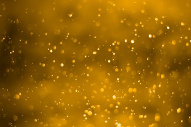 Altın parıltılı klasik ışıklar arka planda. Sarı bokeh arkaplanı.