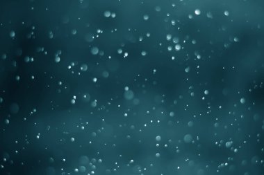 Mavi parıltılı klasik ışık arka planı. Mavi arkaplanda beyaz bokeh.