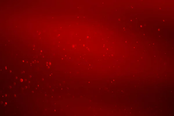 Kırmızı parıltılı klasik ışık arka planı. kırmızı bokeh arkaplanı.
