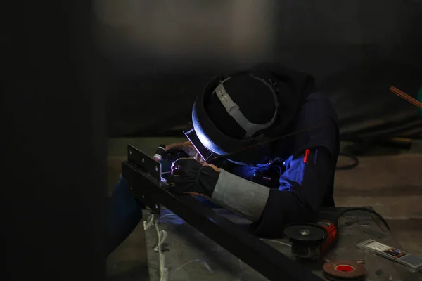 Metal workers use manual labor. Skilled welder. Factory workers making OT. Welder is welding the steel in the factory. welder Industrial automotive part in factory.