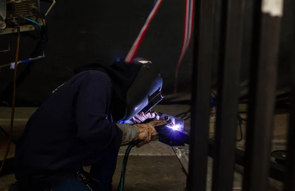 Metal workers use manual labor. Skilled welder. Factory workers making OT. Welder is welding the steel in the factory. welder Industrial automotive part in factory.