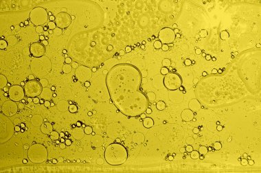 Sarı doku arka planı. Yağ suya düşer. Sarı baloncuk yağı.