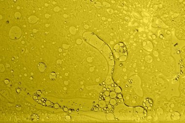 Sarı doku arka planı. Yağ suya düşer. Sarı baloncuk yağı.