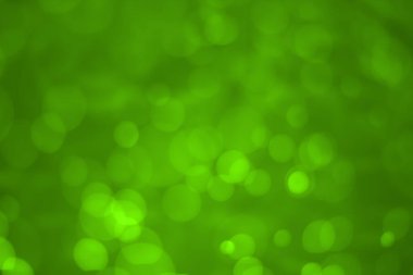 Yeşil parıltılı klasik ışık arka planı. Yeşil arkaplanda beyaz bokeh.