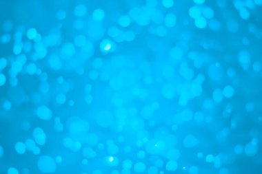 Mavi parıltılı klasik ışık arka planı. Mavi arkaplanda beyaz bokeh.