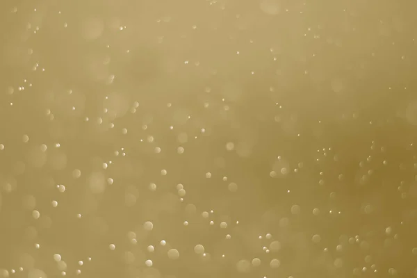 Sarı parıltılı klasik ışık arka planı. Sarı arkaplanda beyaz bokeh.