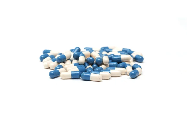 Blue tablets in capsules. Medicine. Photo. — Stock Photo, Image