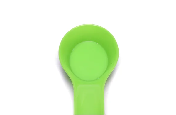 Kuchenne urządzenia - zielony łyżka. Zdjęcie. — Zdjęcie stockowe