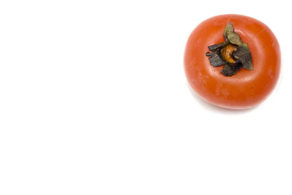 白地にオレンジ色の柿。写真. — ストック写真