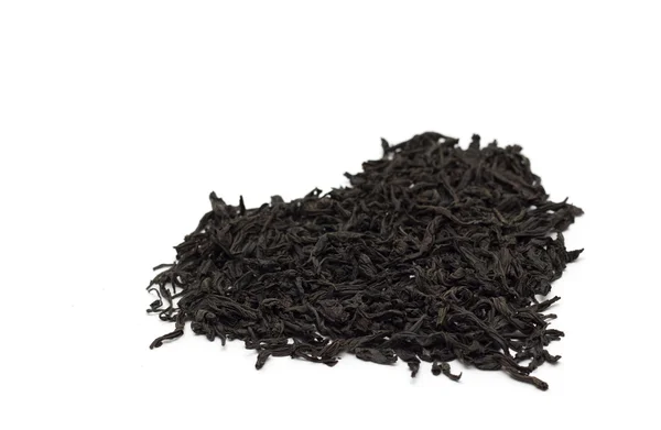 Schwarzer Tee in Herzform. Foto. — Stockfoto