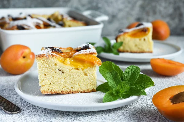 cake with apricots. Homemade pie with peaches and apricots on the kitchen table.