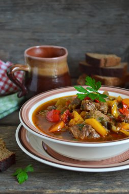 Meat stew with peppers, tomatoes and eggplant clipart