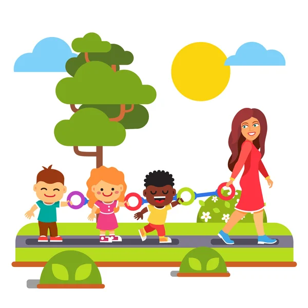 Kindergarten teacher walking with kids outdoors — Stock Vector