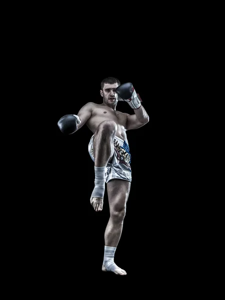 Young thai boxing fighter isolated on black background — Stock Photo, Image