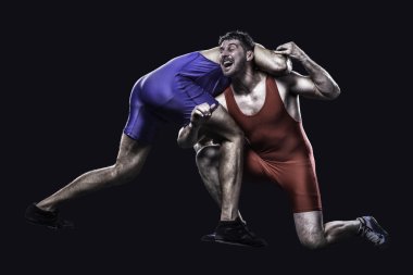 Two freestyle wrestlers in action clipart