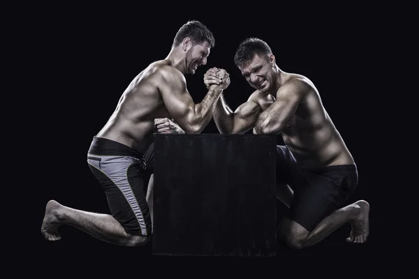 Two athletes arm wrestling — Stock Photo, Image