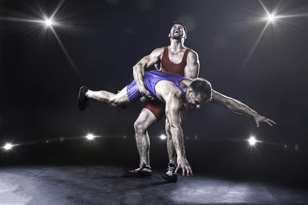 Freestyle wrestler throwing — Stock Photo, Image