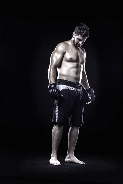 Mixed martial arts fighter isolated on black background — Stock Photo, Image